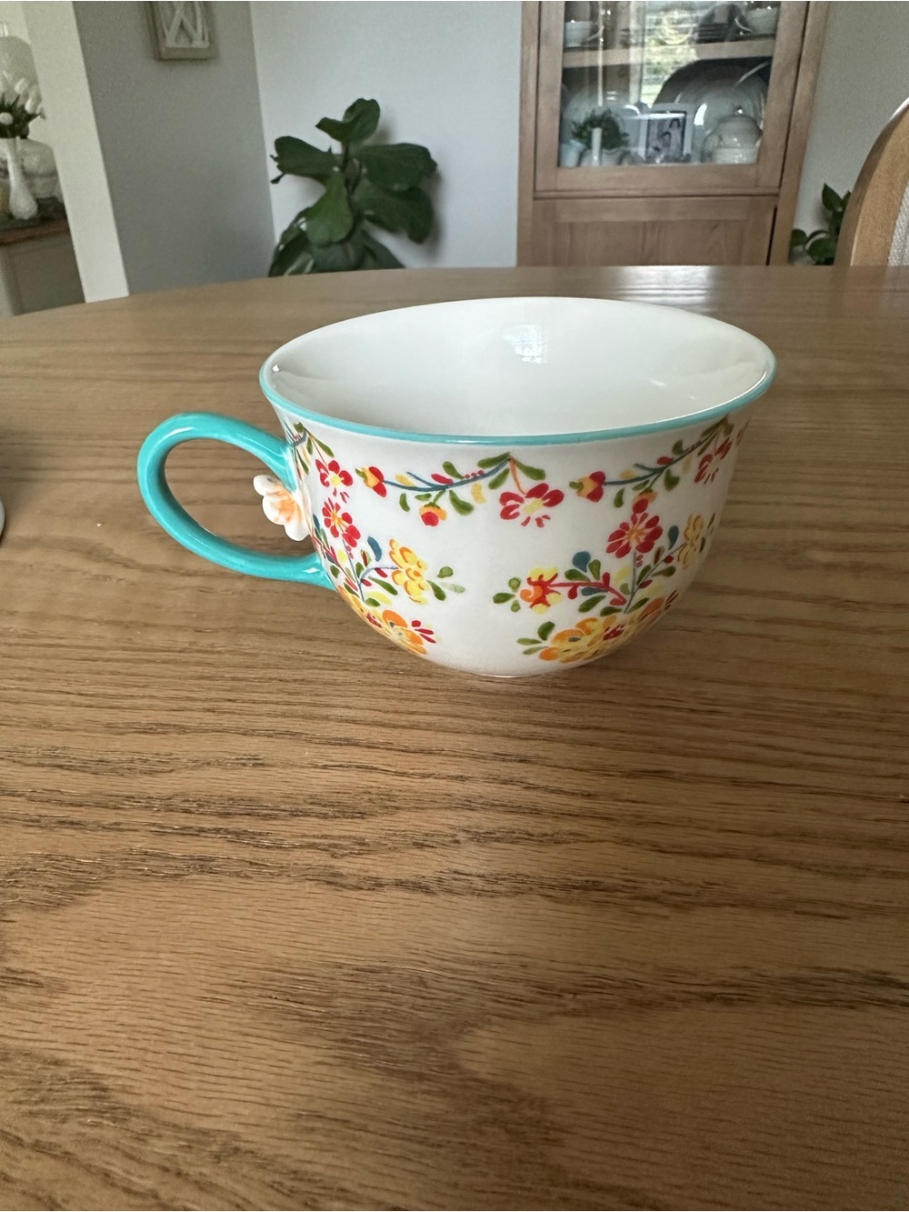 Anthropologie Cadiz Mug with Turquoise Handle and Multicolor Floral Design
